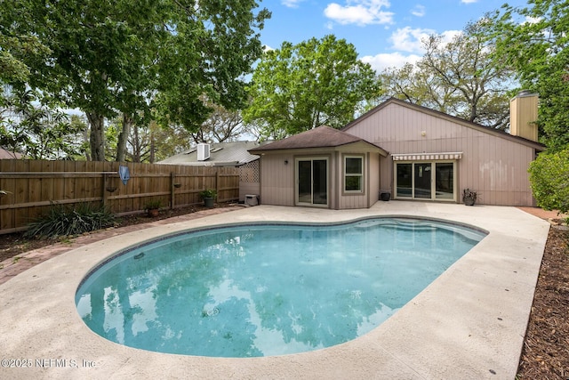 view of swimming pool featuring a fenced in pool, fence private yard, and a patio