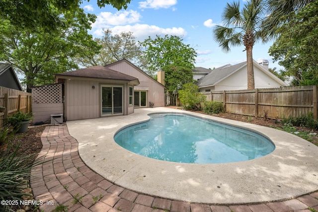 view of swimming pool with a fenced backyard, a fenced in pool, and a patio