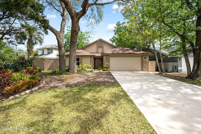 mid-century home with a garage, fence, driveway, and a front lawn