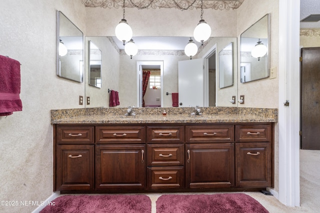 bathroom with double vanity and a sink