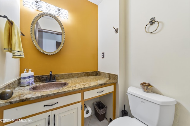 bathroom with toilet and vanity