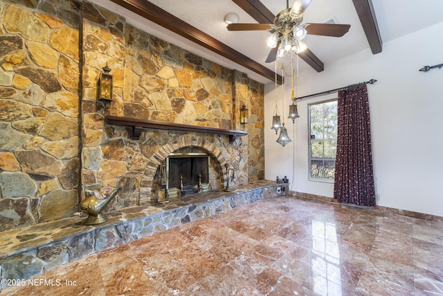 unfurnished living room featuring a textured ceiling, a stone fireplace, baseboards, ceiling fan, and vaulted ceiling with beams