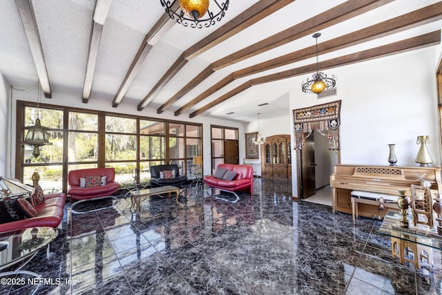 living room with vaulted ceiling with beams and a textured ceiling