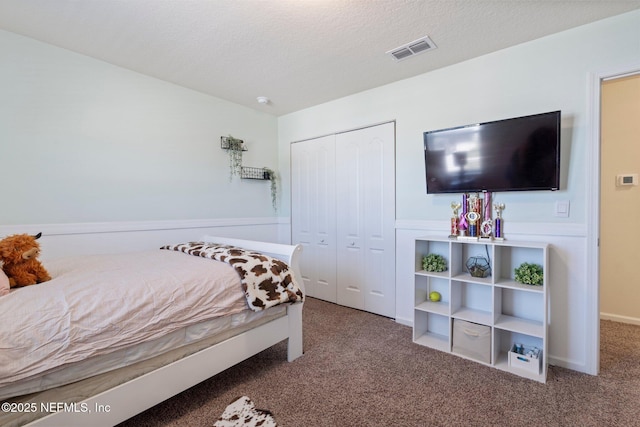 3214 Little Fawn Ln, Green Cove Springs, FL 32043 - carpeted bedroom with visible vents, a textured ceiling, and a closet
