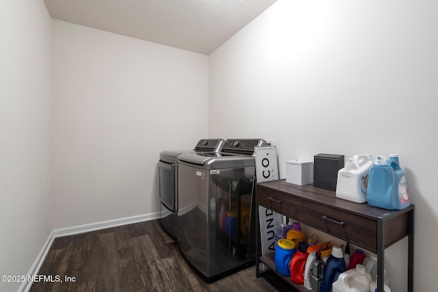 3214 Little Fawn Ln, Green Cove Springs, FL 32043 - laundry area with baseboards, laundry area, dark wood-style flooring, a textured ceiling, and washer and clothes dryer