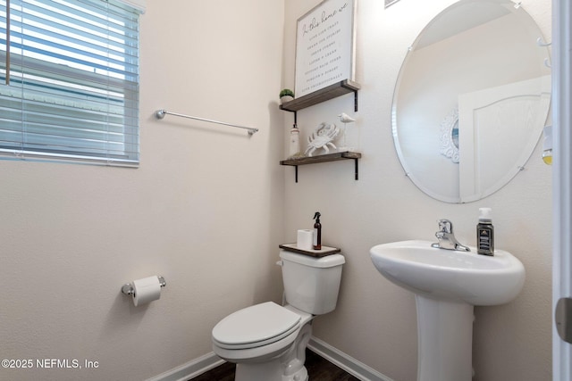 3214 Little Fawn Ln, Green Cove Springs, FL 32043 - half bathroom featuring a sink, baseboards, toilet, and wood finished floors