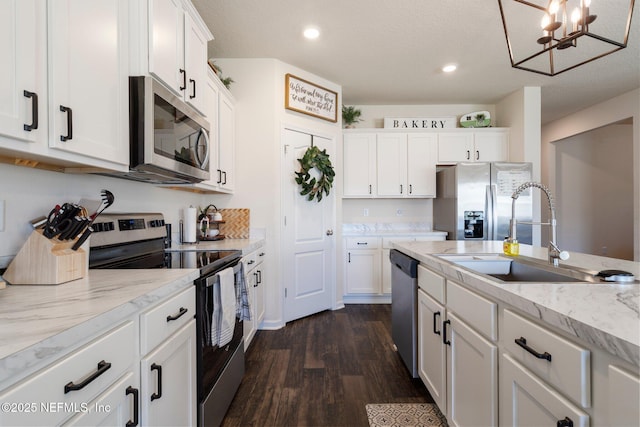 3214 Little Fawn Ln, Green Cove Springs, FL 32043 - kitchen featuring a sink, appliances with stainless steel finishes, white cabinets, light stone countertops, and dark wood-style flooring