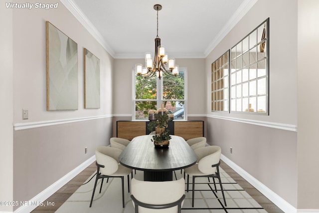 dining area featuring dark wood finished floors, a healthy amount of sunlight, and a chandelier