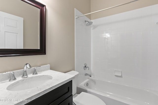 bathroom with toilet, vanity, and bathing tub / shower combination