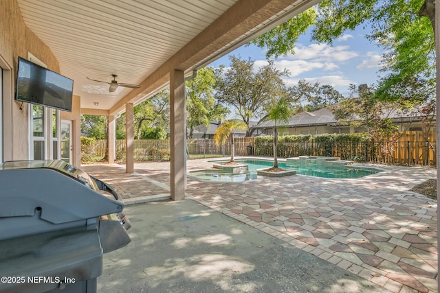 view of patio / terrace with an in ground hot tub, a fenced in pool, area for grilling, a fenced backyard, and ceiling fan