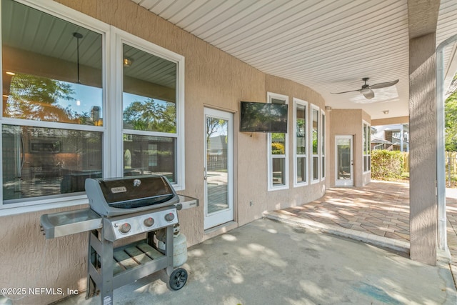 view of patio / terrace with a grill and ceiling fan