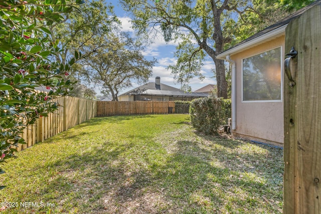 view of yard featuring a fenced backyard
