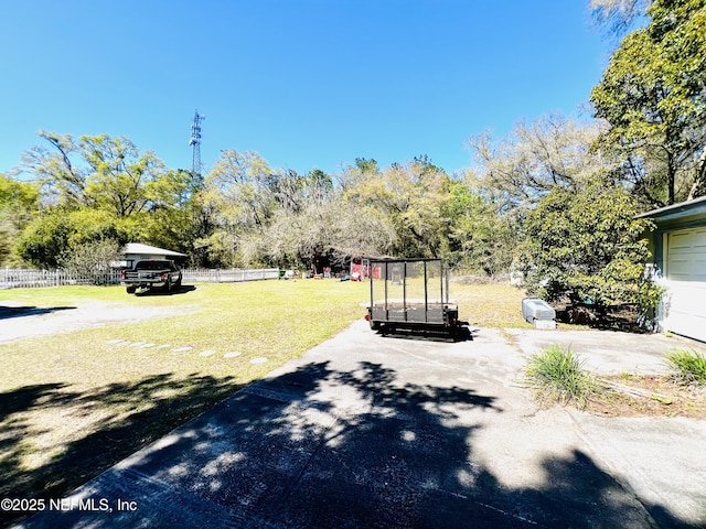 view of road with a gated entry and driveway