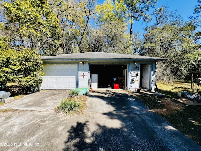 garage featuring driveway