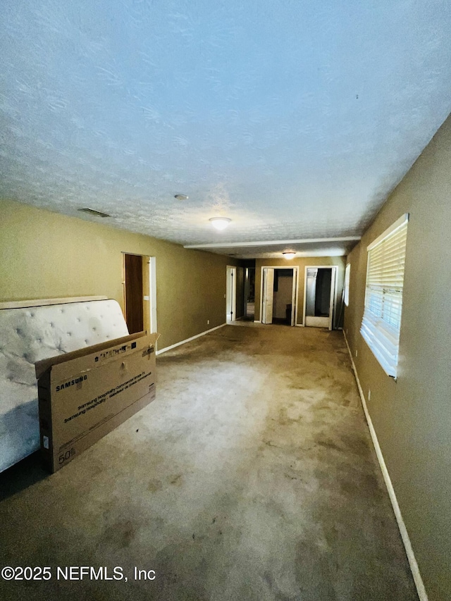 2731 Howard Rd, Middleburg, FL 32068 - unfurnished living room featuring baseboards and carpet