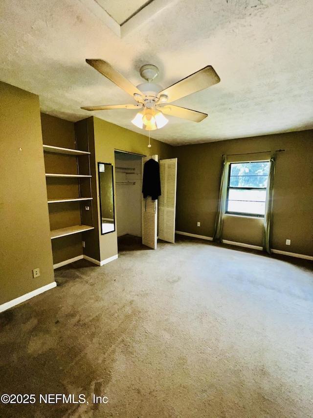 2731 Howard Rd, Middleburg, FL 32068 - unfurnished bedroom featuring a textured ceiling and carpet
