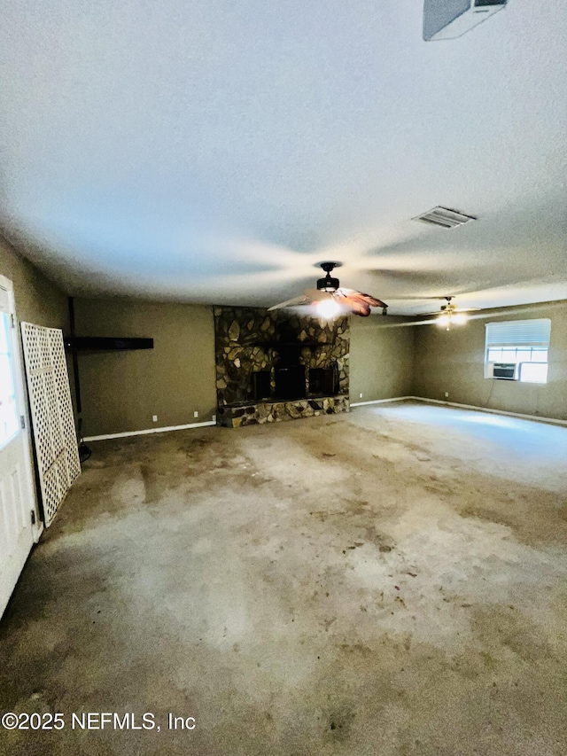 2731 Howard Rd, Middleburg, FL 32068 - unfurnished living room featuring a ceiling fan, a stone fireplace, and carpet floors