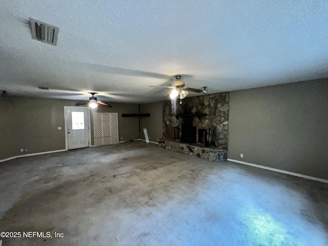 2731 Howard Rd, Middleburg, FL 32068 - unfurnished living room with a ceiling fan, a textured ceiling, and a fireplace
