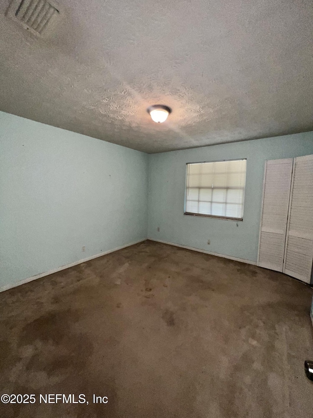 2731 Howard Rd, Middleburg, FL 32068 - unfurnished room featuring a textured ceiling and carpet floors