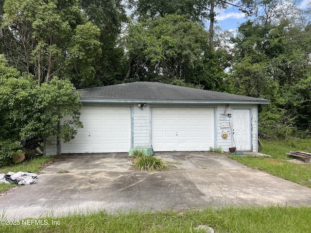 2731 Howard Rd, Middleburg, FL 32068 - detached garage featuring view of scattered trees
