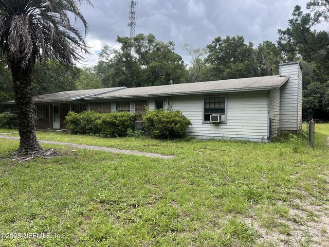 2731 Howard Rd, Middleburg, FL 32068 - ranch-style home with a chimney and cooling unit