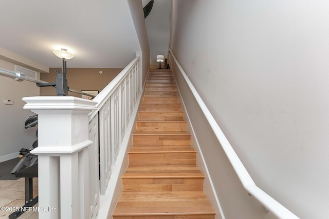 525 3rd St N Unit 210, Jacksonville Beach, FL 32250 - staircase with wood finished floors and baseboards