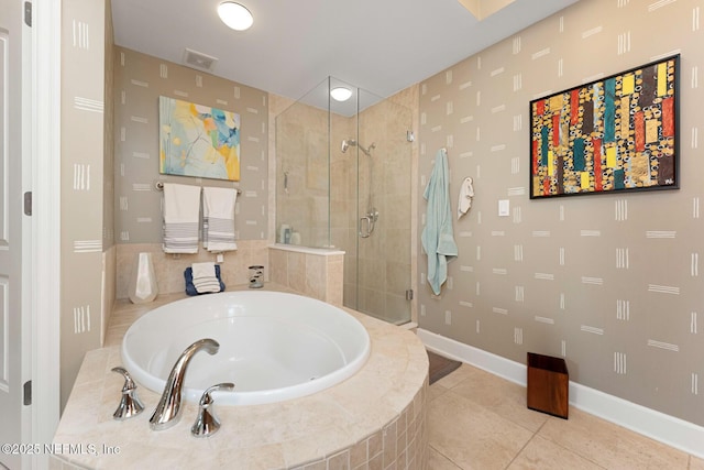 525 3rd St N Unit 210, Jacksonville Beach, FL 32250 - full bathroom with tile patterned floors, visible vents, a garden tub, a stall shower, and baseboards