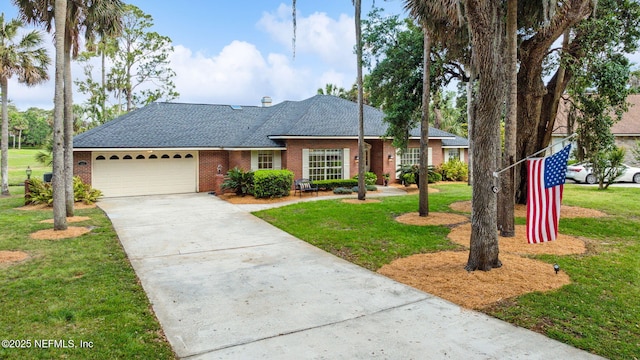 single story home with brick siding, driveway, a front yard, and a garage
