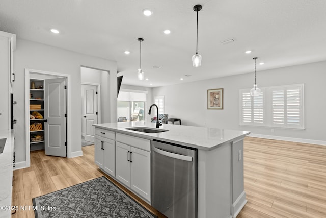 95058 Rocky Pl, Fernandina Beach, FL 32034 - kitchen with light wood finished floors, plenty of natural light, dishwasher, and a sink