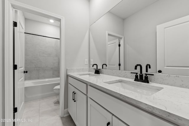 95058 Rocky Pl, Fernandina Beach, FL 32034 - full bath featuring double vanity, toilet, tile patterned floors, and a sink