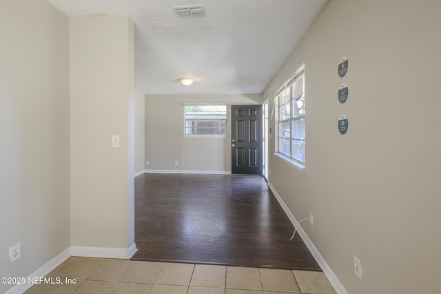 2108 W 15th St, Jacksonville, FL 32209 - foyer with tile patterned floors, visible vents, and baseboards