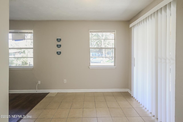 2108 W 15th St, Jacksonville, FL 32209 - empty room with light tile patterned floors and baseboards