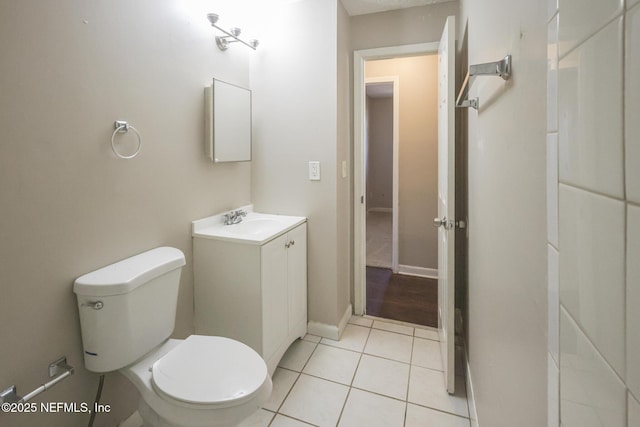 2108 W 15th St, Jacksonville, FL 32209 - bathroom with baseboards, toilet, vanity, and tile patterned flooring