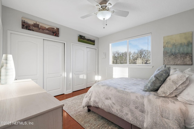 2114 Gail Ave Unit A, Jacksonville Beach, FL 32250 - bedroom with a ceiling fan, two closets, and dark wood finished floors