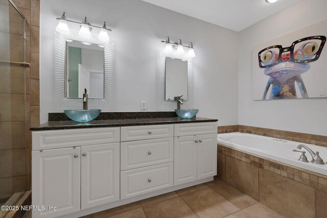 2114 Gail Ave Unit A, Jacksonville Beach, FL 32250 - bathroom with tile patterned floors, a garden tub, a sink, and double vanity
