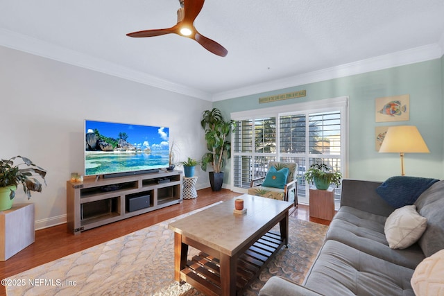 2114 Gail Ave Unit A, Jacksonville Beach, FL 32250 - living area featuring a ceiling fan, baseboards, crown molding, and wood finished floors