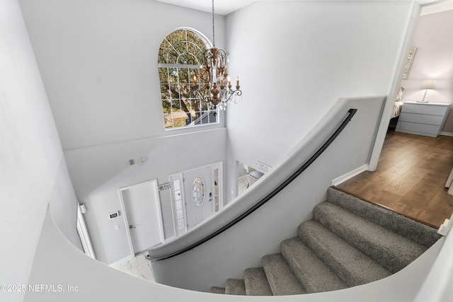 11 Reeding Ridge Dr W, Jacksonville, FL 32225 - staircase with wood finished floors and a chandelier