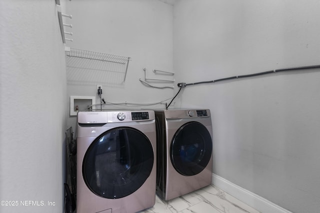11 Reeding Ridge Dr W, Jacksonville, FL 32225 - clothes washing area with baseboards, marble finish floor, washing machine and dryer, and laundry area