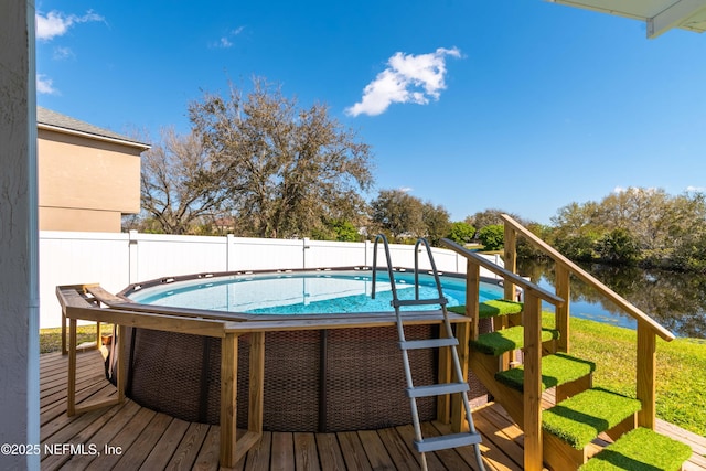 11 Reeding Ridge Dr W, Jacksonville, FL 32225 - view of pool featuring a fenced in pool, a water view, and fence