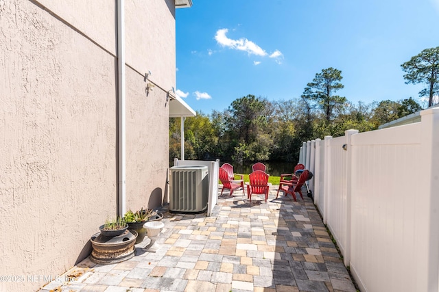 11 Reeding Ridge Dr W, Jacksonville, FL 32225 - view of patio featuring central air condition unit and fence