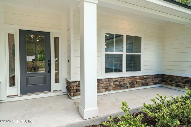 85172 Southern Creek Blvd, Fernandina Beach, FL 32034 - entrance to property featuring covered porch and stone siding