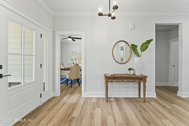 85172 Southern Creek Blvd, Fernandina Beach, FL 32034 - entrance foyer with light wood-type flooring, ornamental molding, baseboards, and a notable chandelier