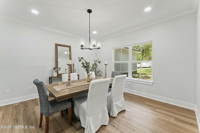 85172 Southern Creek Blvd, Fernandina Beach, FL 32034 - dining room with an inviting chandelier, light wood-style flooring, recessed lighting, baseboards, and ornamental molding