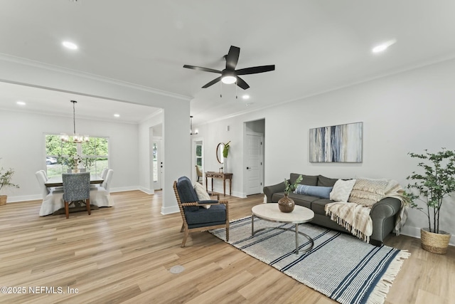 85172 Southern Creek Blvd, Fernandina Beach, FL 32034 - living area with light wood-style floors, crown molding, ceiling fan with notable chandelier, and recessed lighting