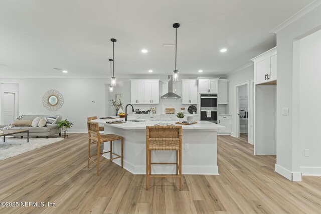 85172 Southern Creek Blvd, Fernandina Beach, FL 32034 - kitchen featuring white cabinets, open floor plan, wall chimney exhaust hood, and double oven