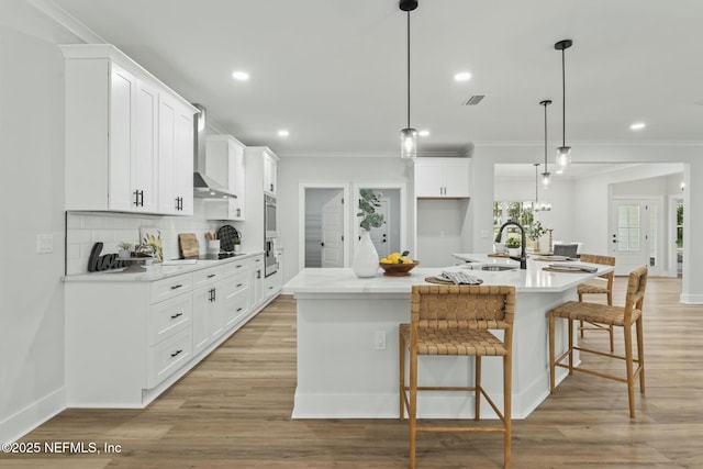 85172 Southern Creek Blvd, Fernandina Beach, FL 32034 - kitchen featuring crown molding, oven, wall chimney exhaust hood, tasteful backsplash, and a sink