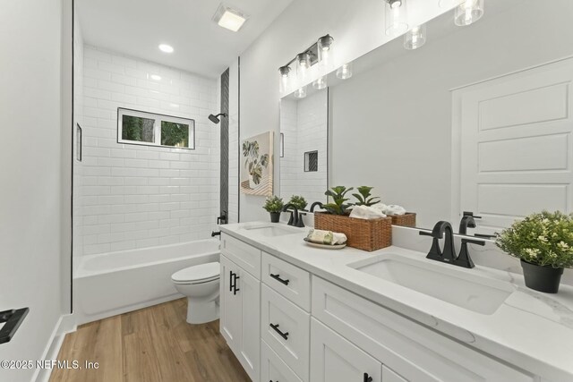 85172 Southern Creek Blvd, Fernandina Beach, FL 32034 - bathroom featuring a sink, double vanity, toilet, and wood finished floors
