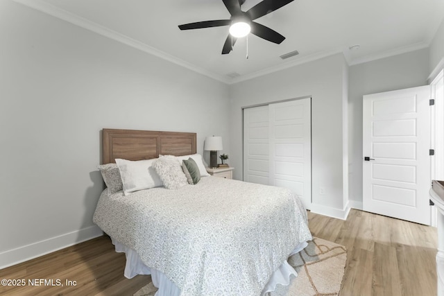 85172 Southern Creek Blvd, Fernandina Beach, FL 32034 - bedroom with crown molding, light wood finished floors, baseboards, and a closet