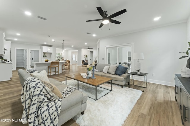 85172 Southern Creek Blvd, Fernandina Beach, FL 32034 - living room featuring a ceiling fan, baseboards, recessed lighting, light wood-type flooring, and visible vents