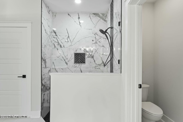 85172 Southern Creek Blvd, Fernandina Beach, FL 32034 - bathroom featuring toilet, baseboards, and a marble finish shower